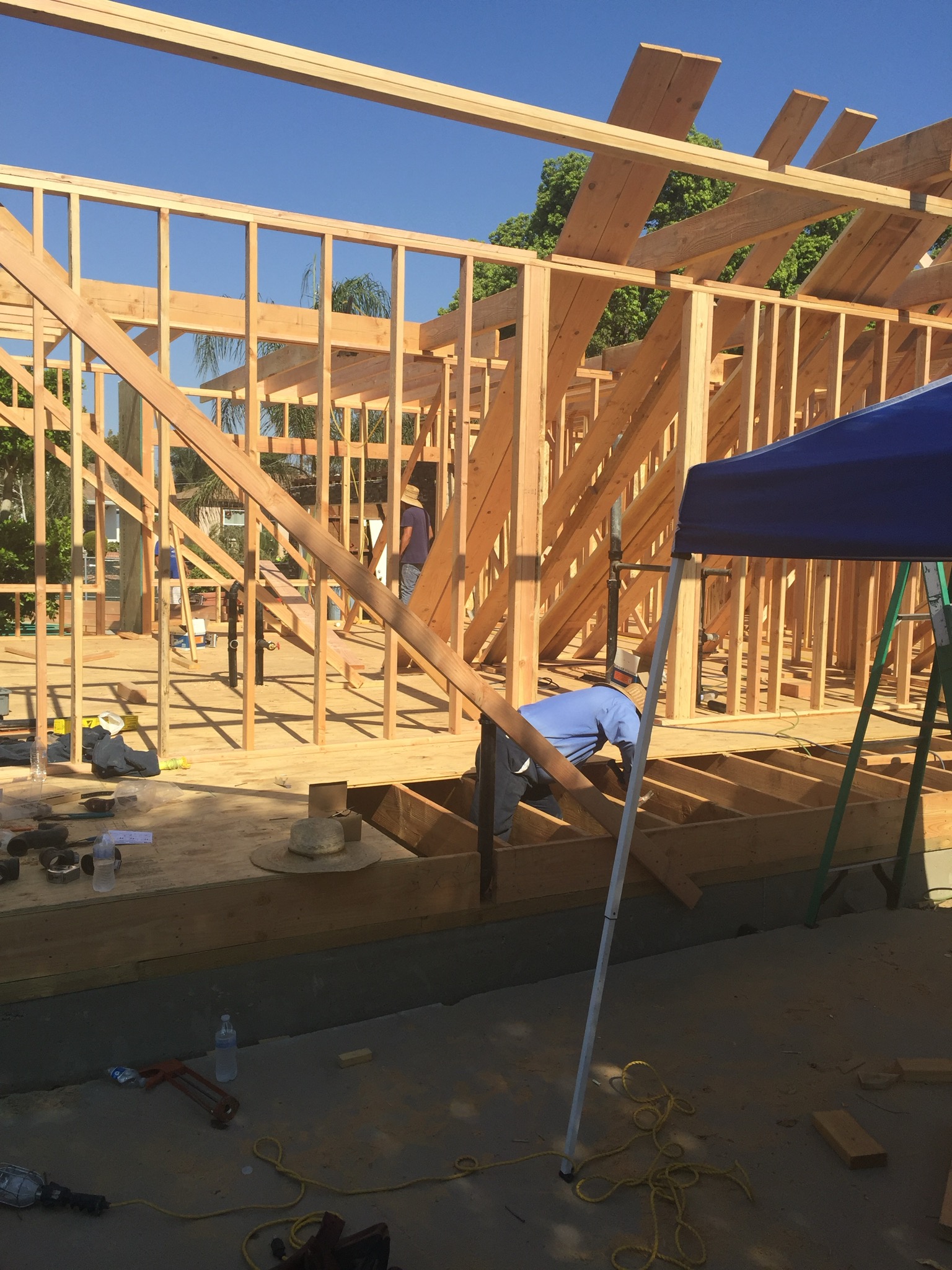 A man laying on the floor of a house under construction